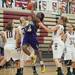 Ypsilanti's Jasmine Jones is blocked as she jumps to make a basket against Dexter during their game, Friday Jan. 11.
Courtney Sacco I AnnArbor.com 